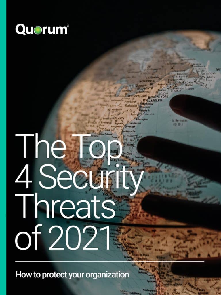 A hand hovers over a globe with a focus on western Europe, Africa, and the Americas. The text reads: "Quorum. The Top 4 Security Threats of 2021. How to protect your organization.