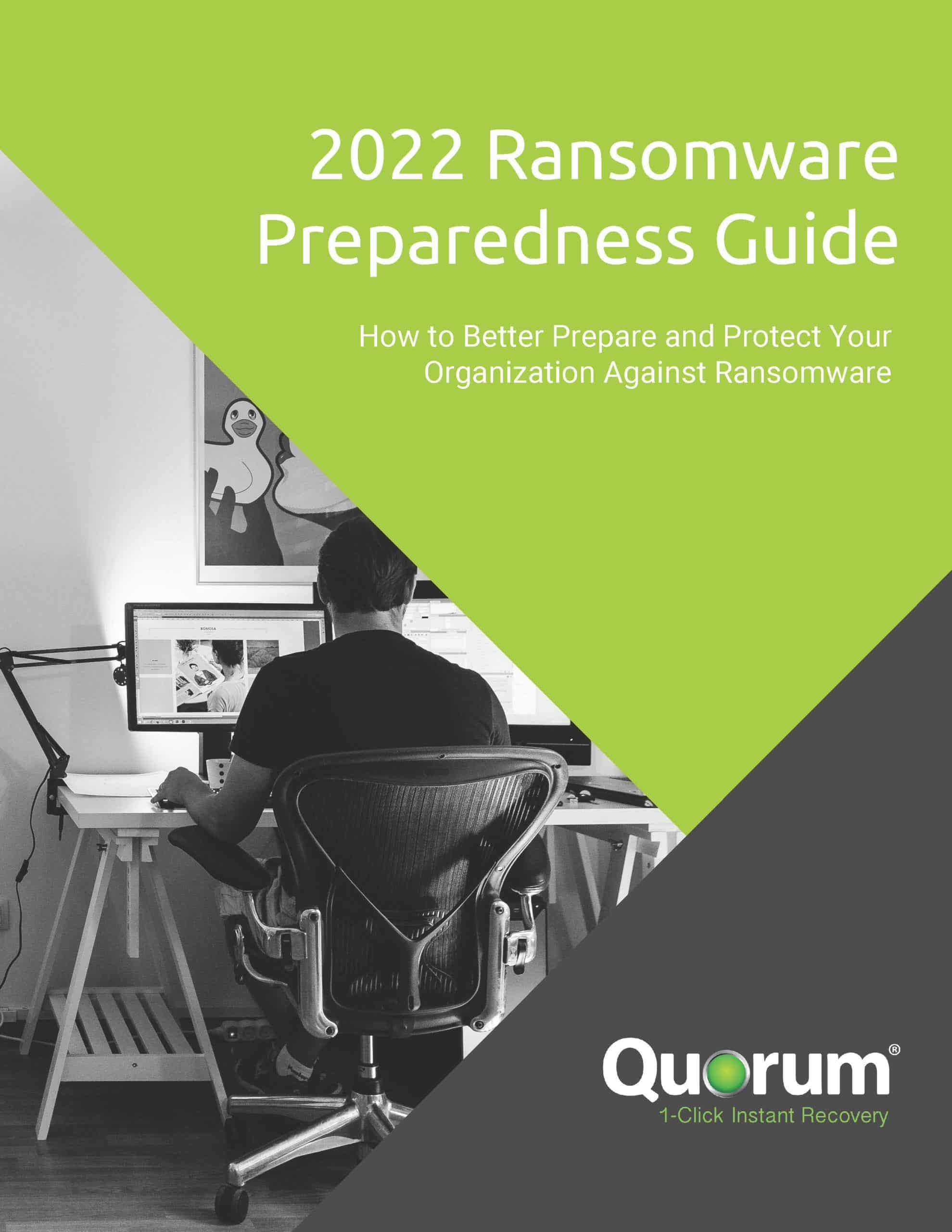 A person sits in a modern office chair working on a computer with multiple monitors. The text on the image reads, "2022 Ransomware Preparedness Guide: How to Better Prepare and Protect Your Organization Against Ransomware," with a logo for "Quorum 1-Click Instant Recovery" at the bottom.
