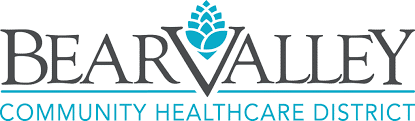 Logo of Bear Valley Community Healthcare District. "Bear Valley" is in large, black uppercase letters with a blue icon resembling a pinecone or flower above the "V". Below it, in smaller blue uppercase letters, are the words "Community Healthcare District.